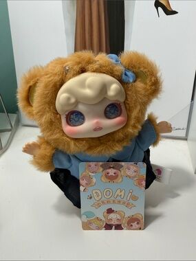 Domi Plush Doll in Blue Outfit with Brown Fuzzy Hood